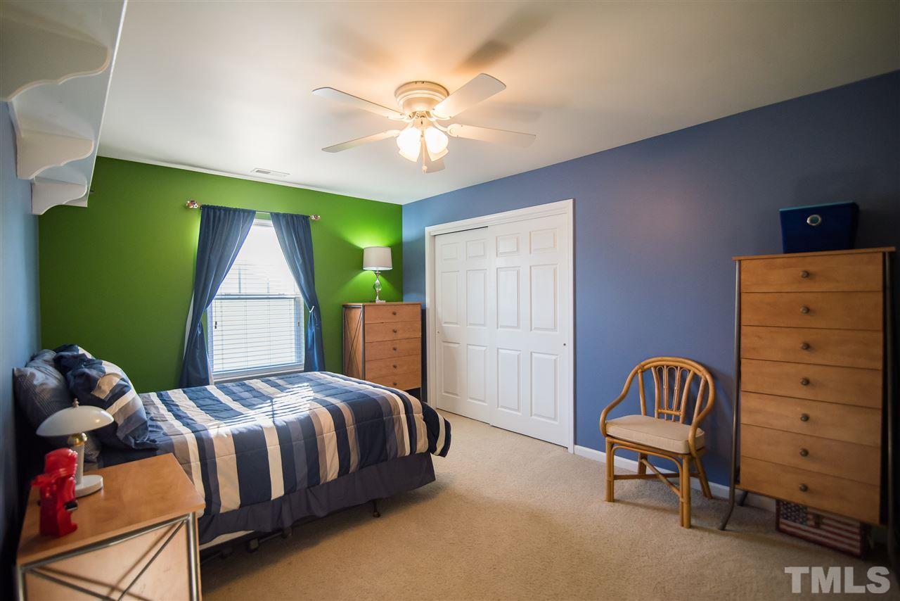 2307 Bright Future Way Raleigh, NC 27614 - Photo 18 of 23 Bedroom featuring plush carpet, single window and large double door closet.