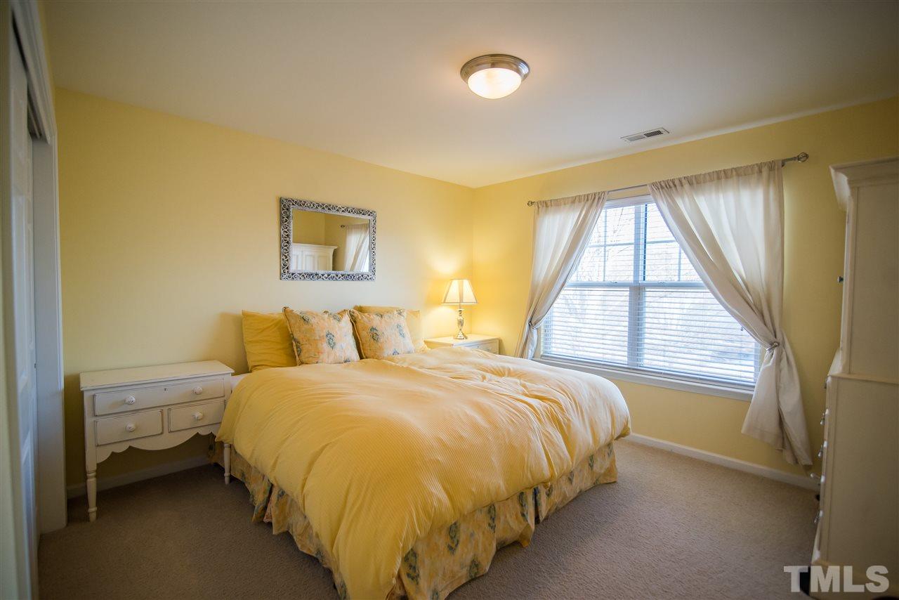 2307 Bright Future Way Raleigh, NC 27614 - Photo 19 of 23 Bedroom featuring plush carpet, double window and large sliding door closet.