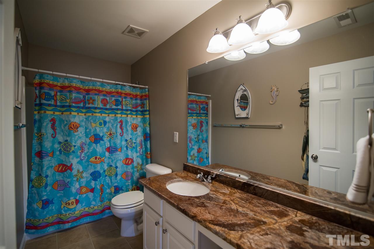 2307 Bright Future Way Raleigh, NC 27614 - Photo 20 of 23 Second floor hallway bathroom has been upgraded with granite countertop and newly tiled floor.