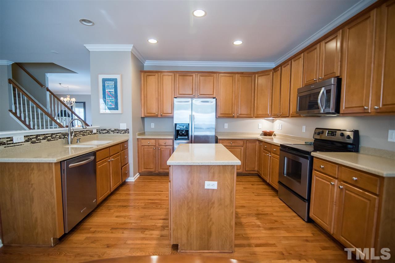 2307 Bright Future Way Raleigh, NC 27614 - Photo 7 of 23 This spectacular kitchen features a large prep island, under cabinet lighting, stainless steel appliances including new microwave and extra quiet dishwasher.
