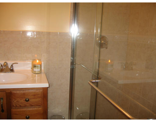 68 Hazen Street Springfield, MA 01119 - Photo 13 of 19 a bathroom with a sink mirror and shower