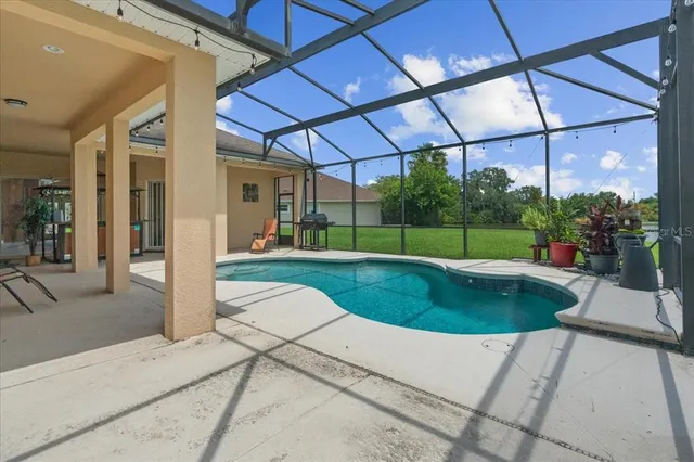 a view of a backyard with sitting area