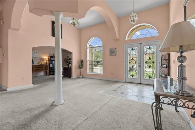 a view of a livingroom with furniture and a window