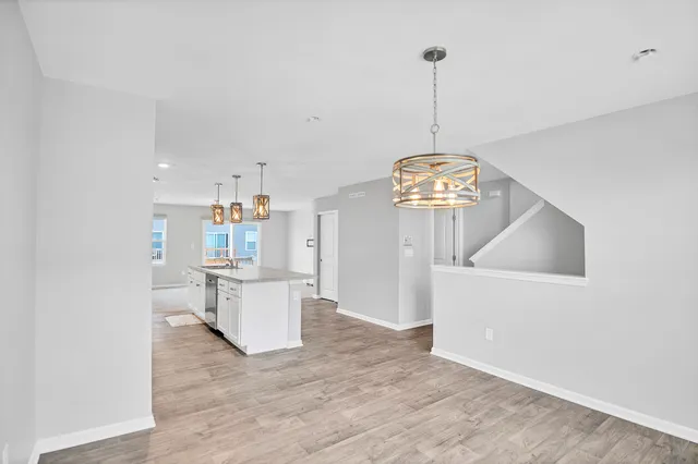 a living room with stainless steel appliances