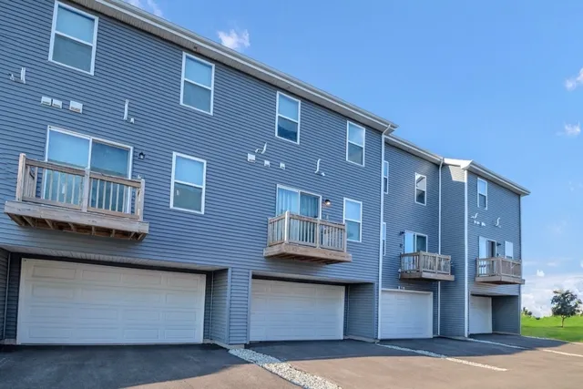 a front view of a building with many windows