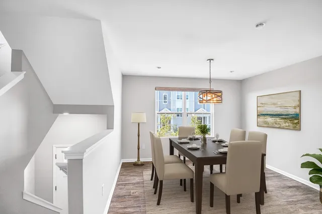 a view of a dining room with furniture and window