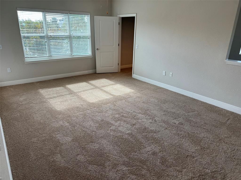 2420 Ann Rou Road, Unit 201 Tavares, FL 32778 - Photo 21 of 25 an empty room with windows