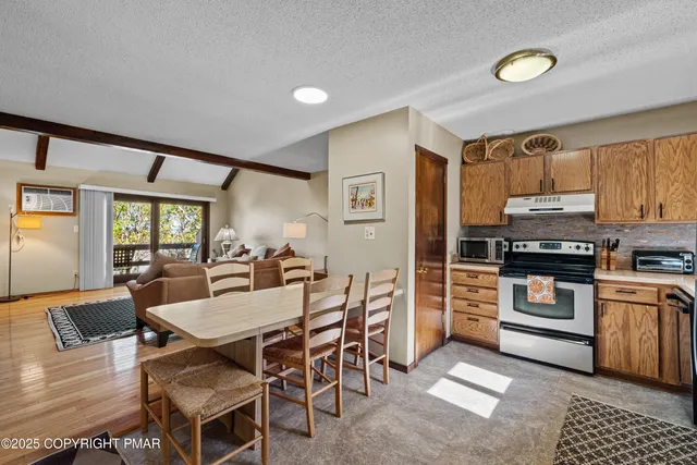 a kitchen with a refrigerator a sink and cabinets