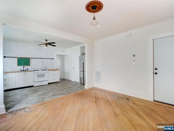 a view of a livingroom with wooden floor