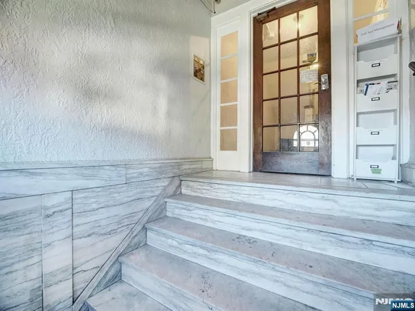 a view of wooden floor and windows in a room