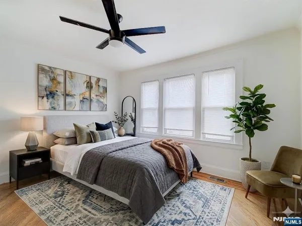 a bedroom with a large bed and a window