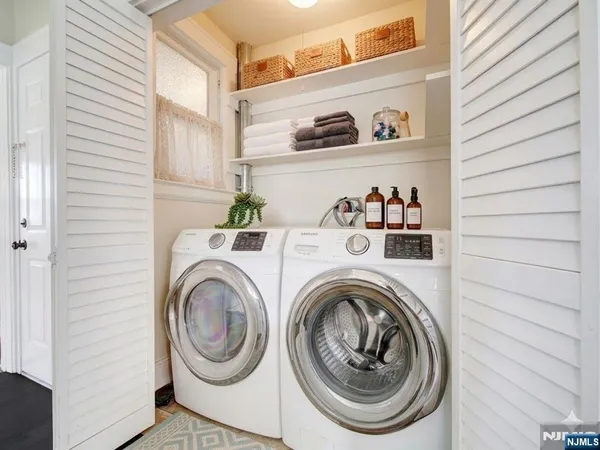 a view of washer and dryer in a bathroom