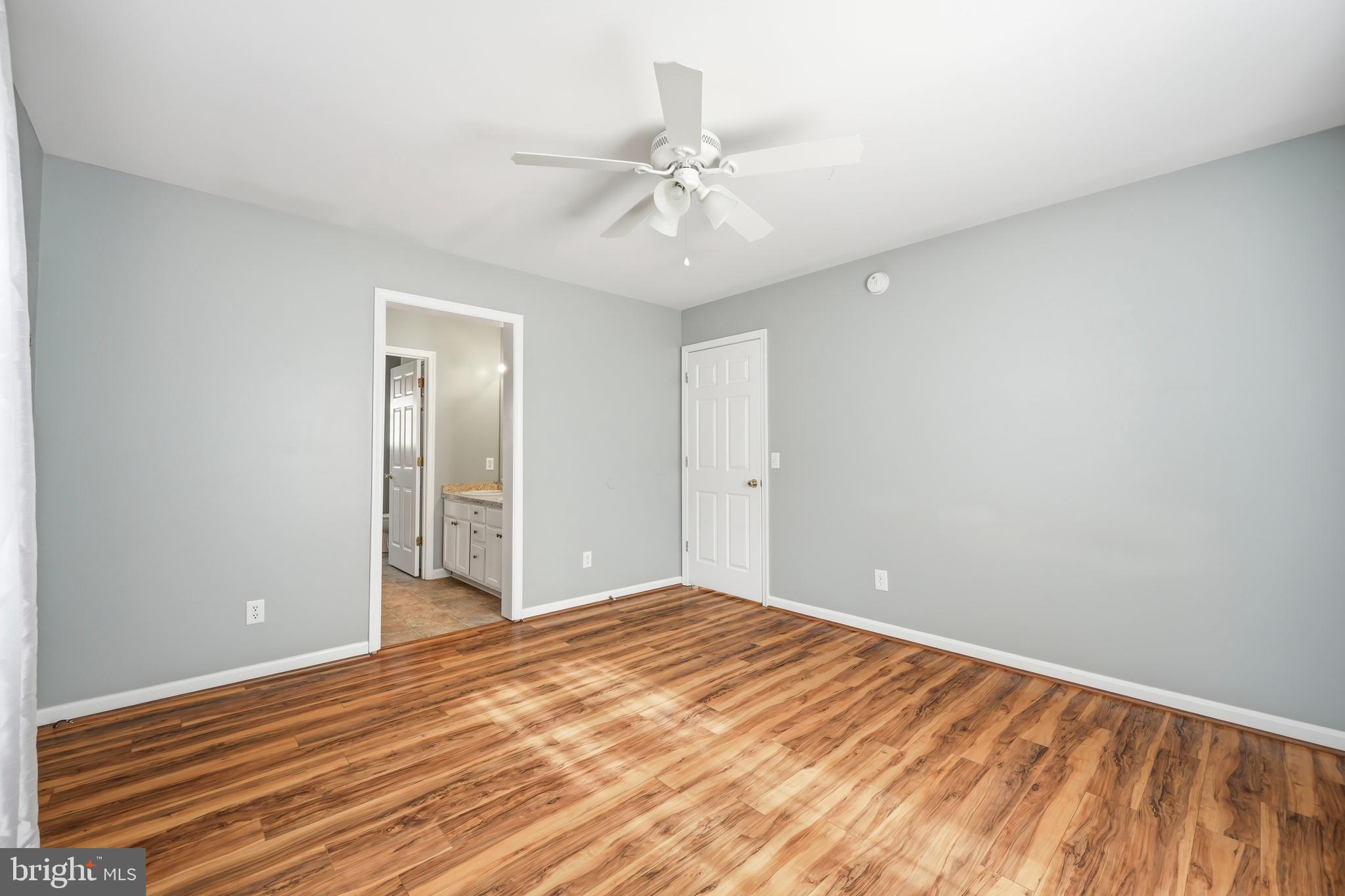 100 Bush Terrace St. Michaels, MD 21663 - Photo 21 of 40 a view of a room with wooden floor and ceiling fan