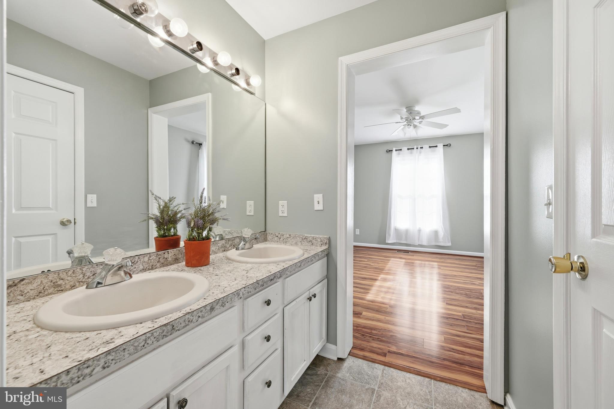 100 Bush Terrace St. Michaels, MD 21663 - Photo 24 of 40 a bathroom with a sink and a mirror
