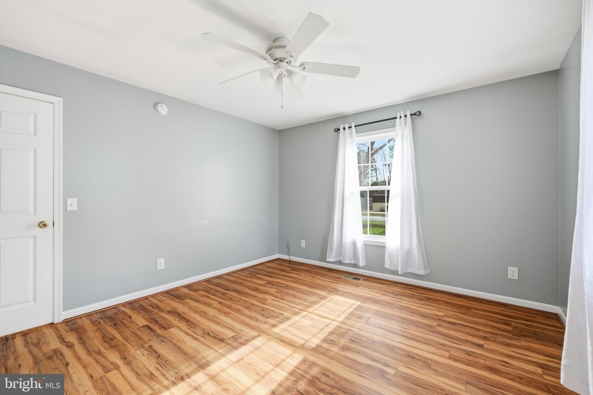 100 Bush Terrace St. Michaels, MD 21663 - Photo 31 of 40 a view of a room with wooden floor and a ceiling fan
