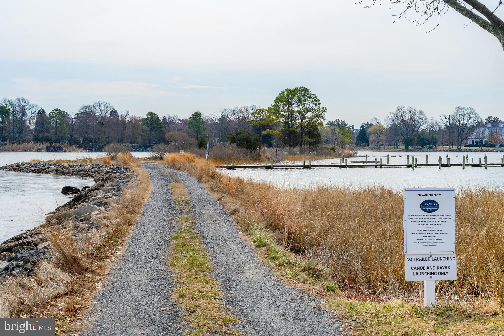 100 Bush Terrace St. Michaels, MD 21663 - Photo 36 of 40 a view of a lake with trees and houses in the back