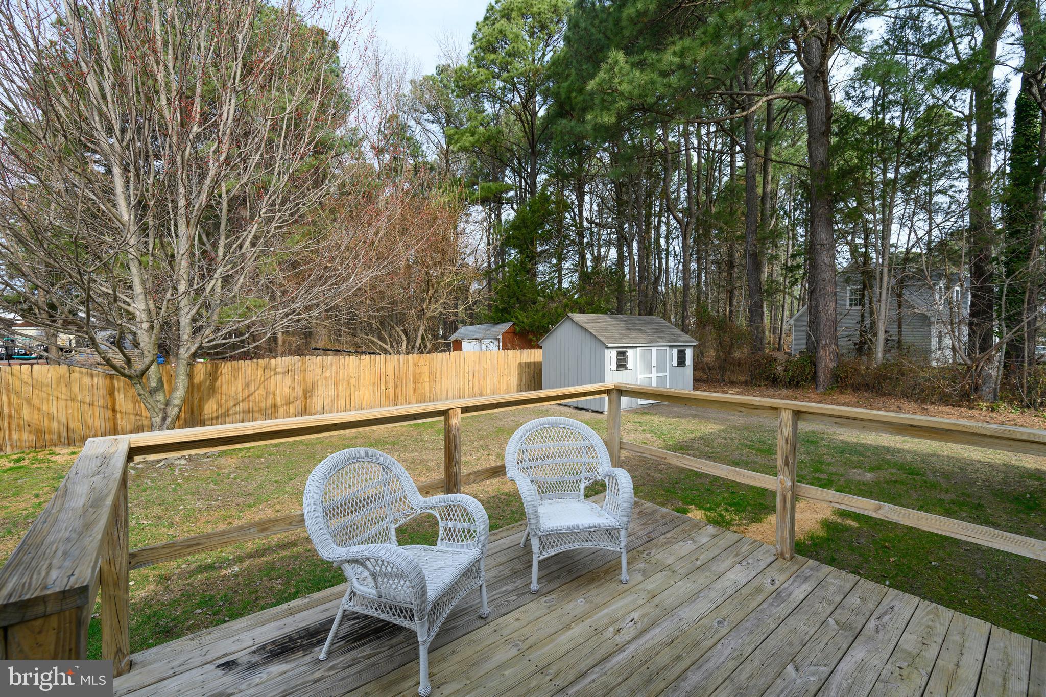 100 Bush Terrace St. Michaels, MD 21663 - Photo 8 of 40 a view of backyard with seating area and trees