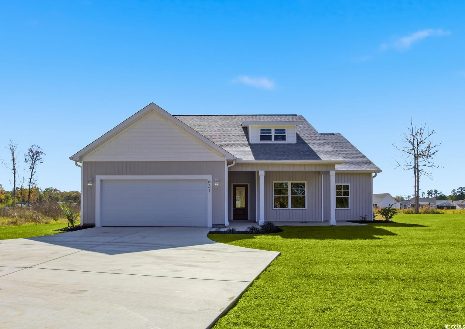View of front of house with a front lawn, a porch, a shingled roof, concrete driveway, and a garage