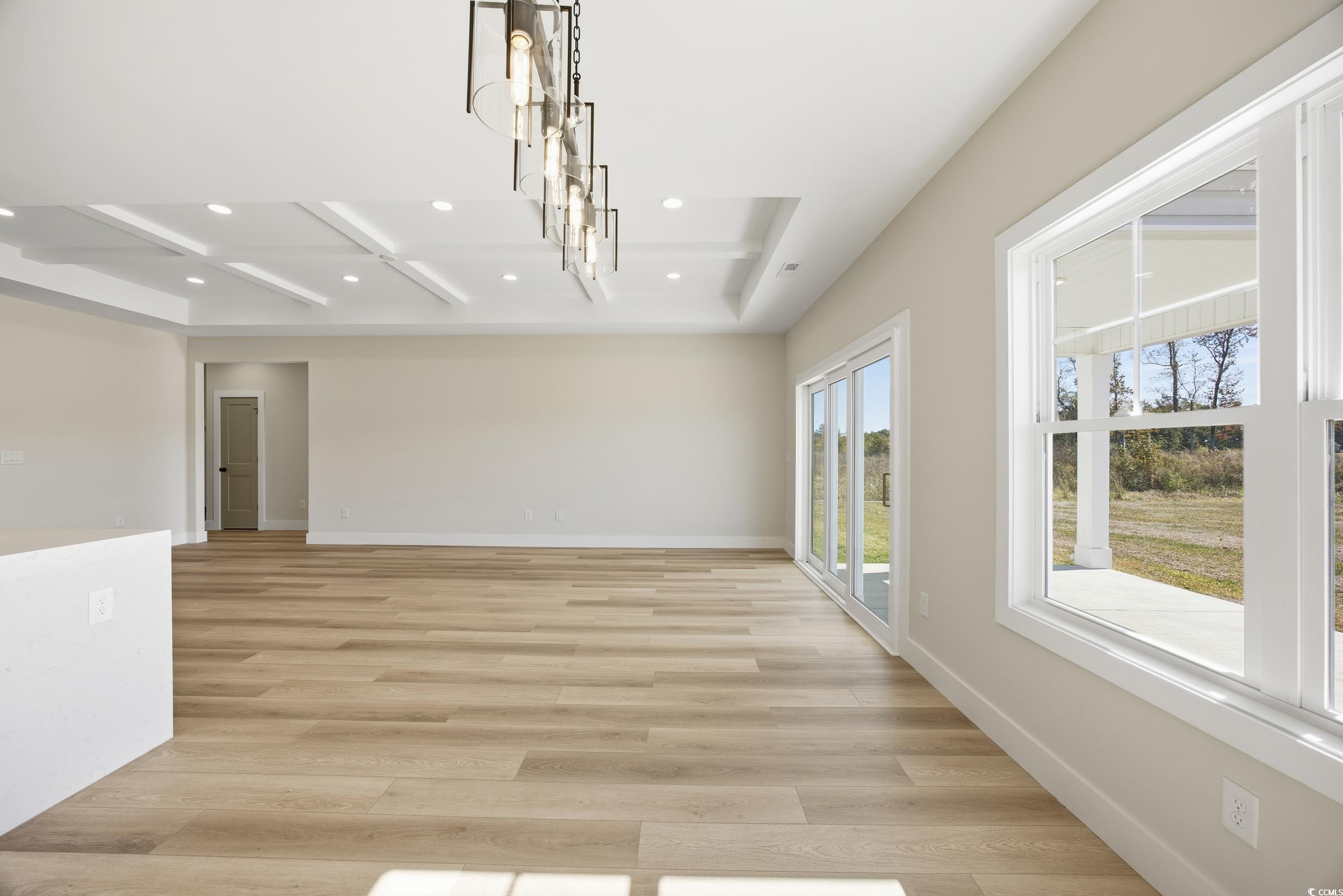 631 Highway 548 Conway Sc 29527 Conway, SC 29527 - Photo 14 of 40 Unfurnished dining area with recessed lighting, light wood-type flooring, beamed ceiling, and coffered ceiling