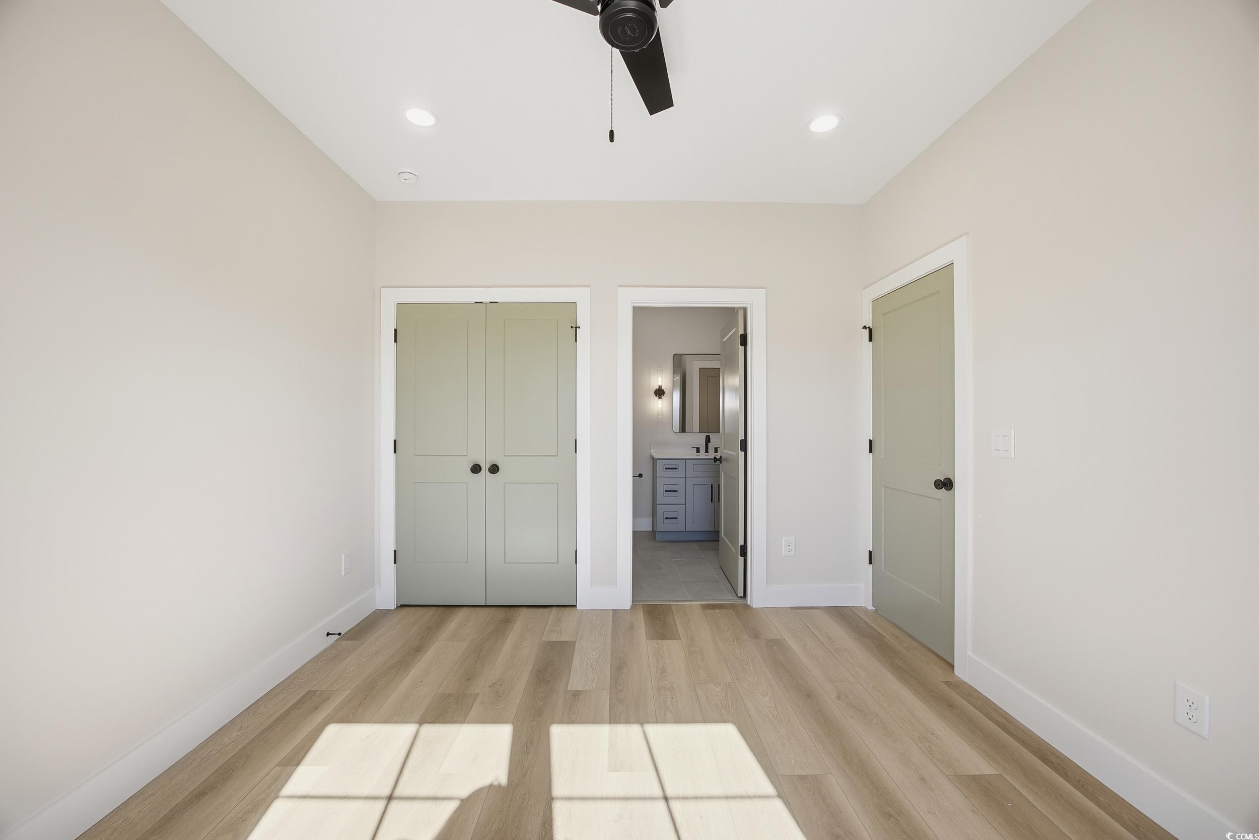 631 Highway 548 Conway Sc 29527 Conway, SC 29527 - Photo 21 of 40 Unfurnished bedroom featuring a closet, light wood-style floors, ensuite bath, recessed lighting, and ceiling fan