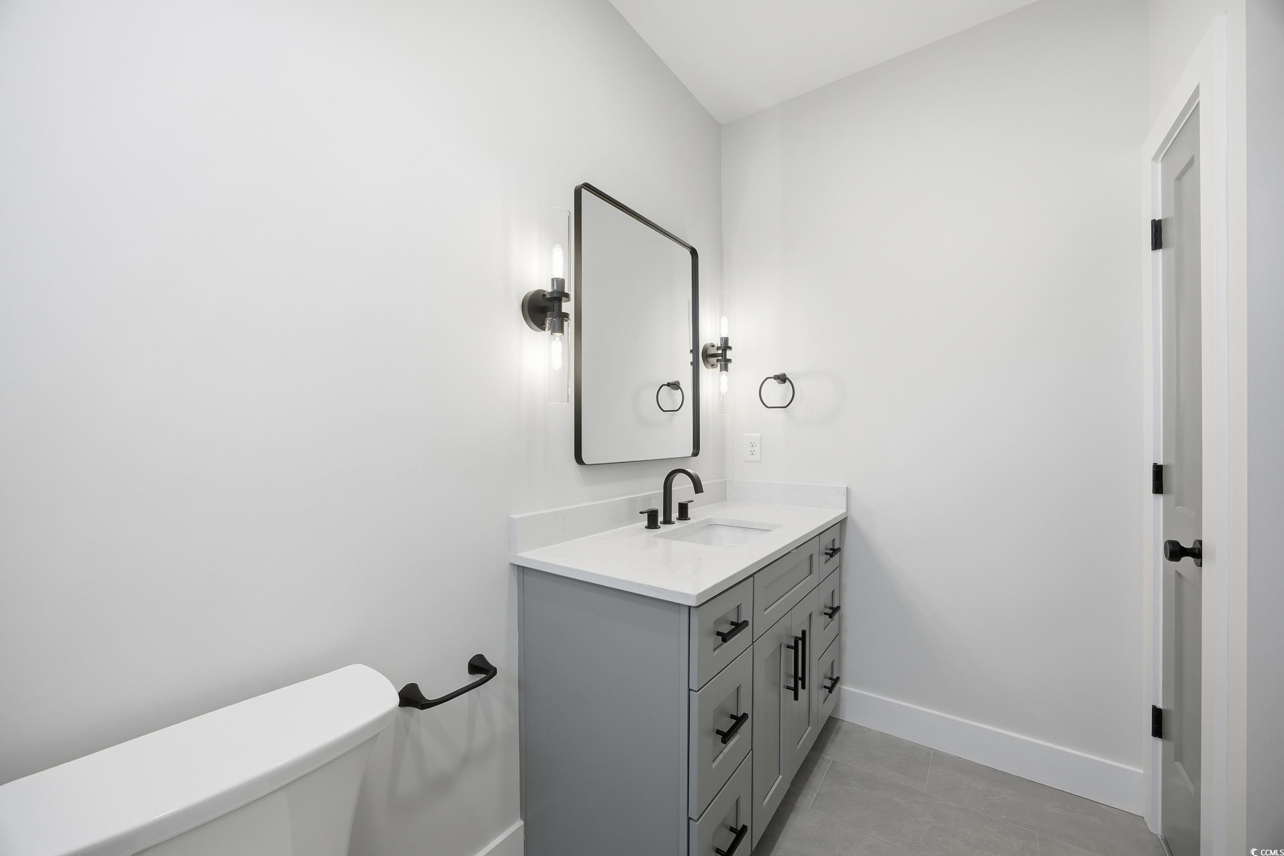 631 Highway 548 Conway Sc 29527 Conway, SC 29527 - Photo 22 of 40 Bathroom with vanity and light tile patterned floors