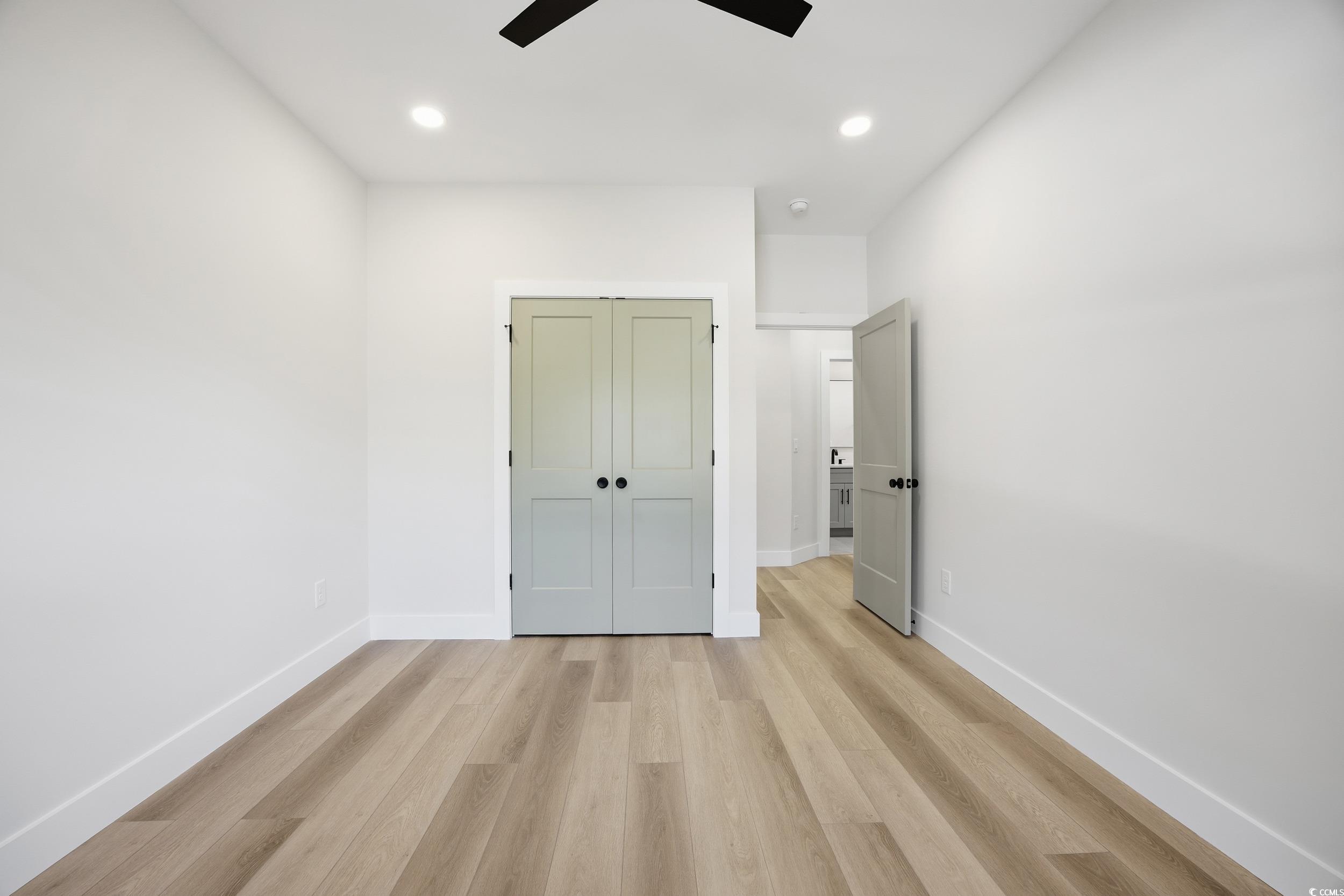 631 Highway 548 Conway Sc 29527 Conway, SC 29527 - Photo 26 of 40 Unfurnished bedroom featuring light wood-style floors, recessed lighting, a closet, and a ceiling fan