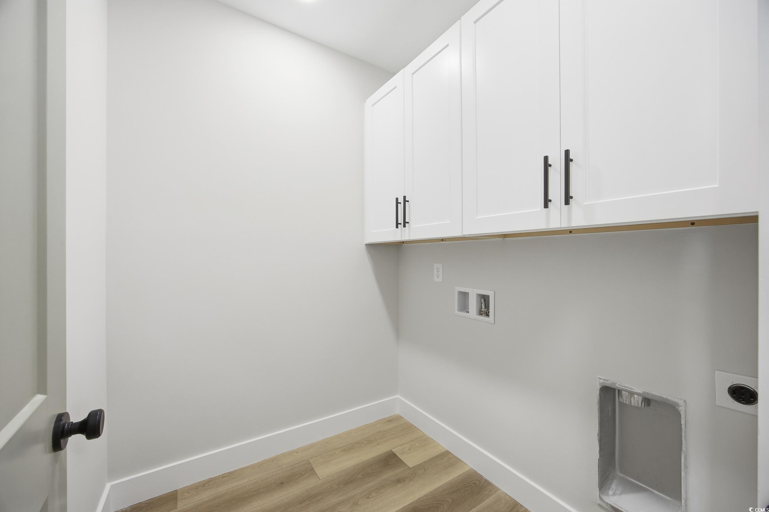 631 Highway 548 Conway Sc 29527 Conway, SC 29527 - Photo 31 of 40 Washroom with light wood-style flooring, washer hookup, and cabinet space
