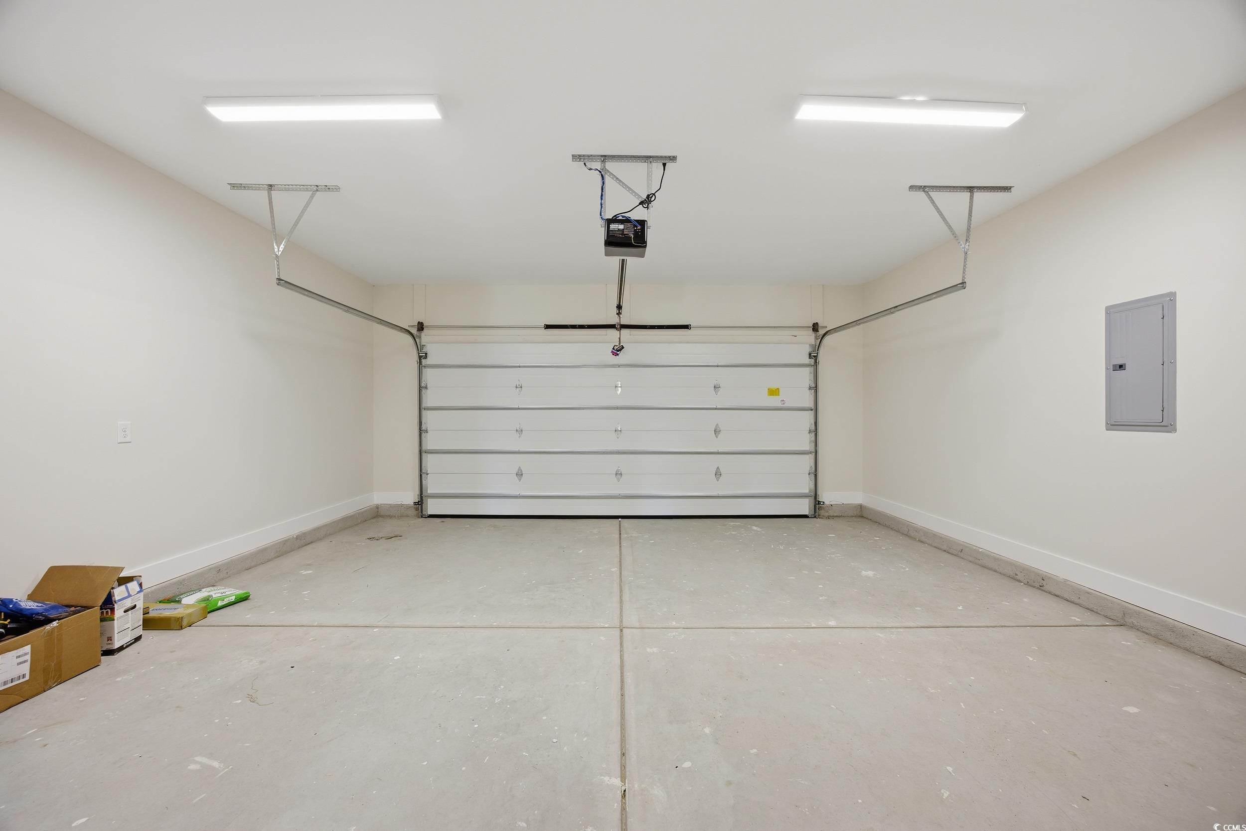 631 Highway 548 Conway Sc 29527 Conway, SC 29527 - Photo 32 of 40 Garage with electric panel and a garage door opener