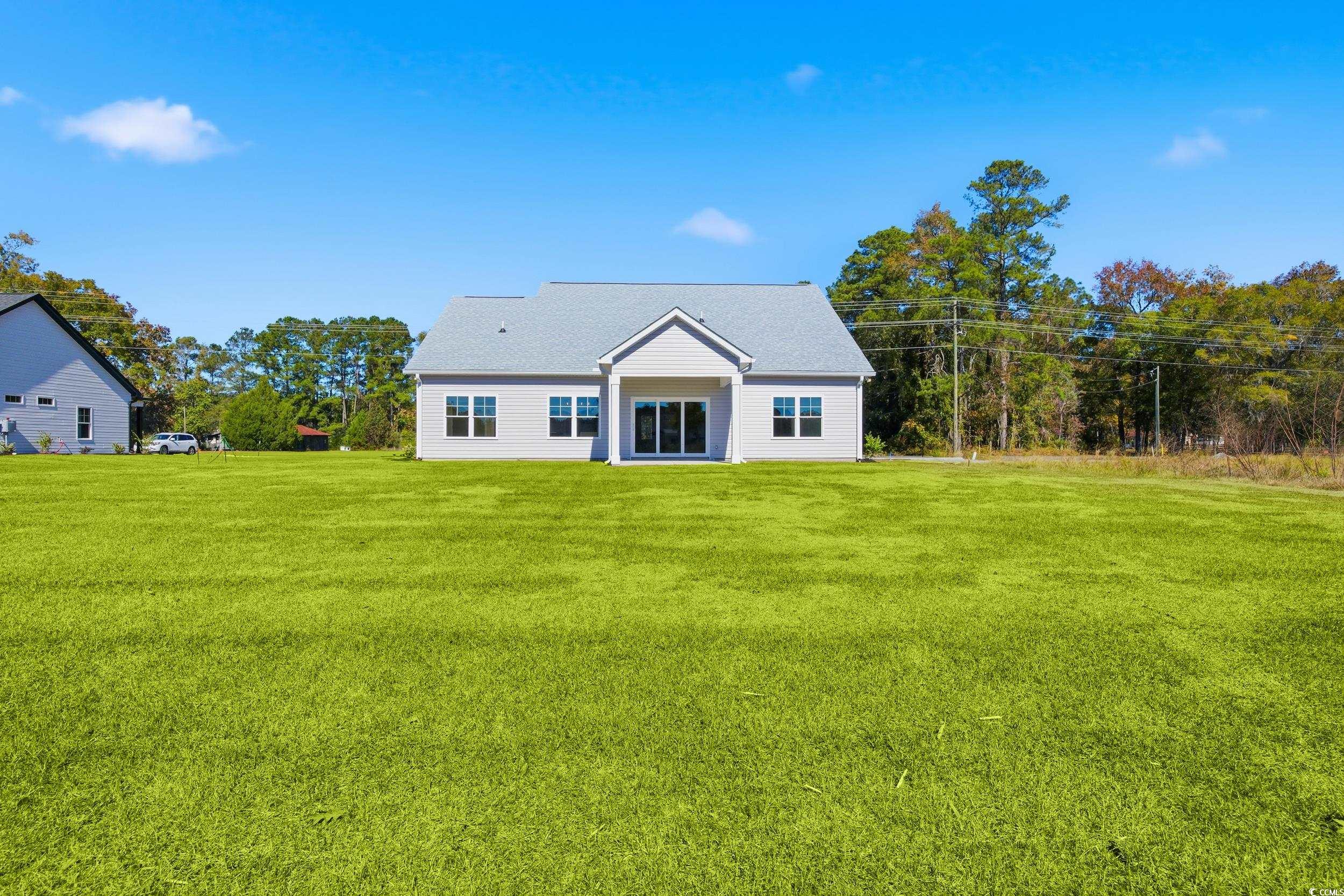 631 Highway 548 Conway Sc 29527 Conway, SC 29527 - Photo 34 of 40 Back of house featuring a lawn and roof with shingles