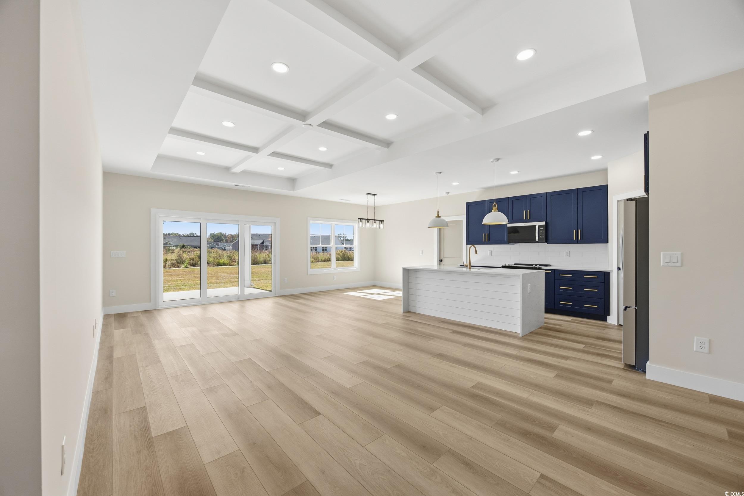 631 Highway 548 Conway Sc 29527 Conway, SC 29527 - Photo 7 of 40 Unfurnished living room with coffered ceiling, beam ceiling, a chandelier, light wood finished floors, and recessed lighting