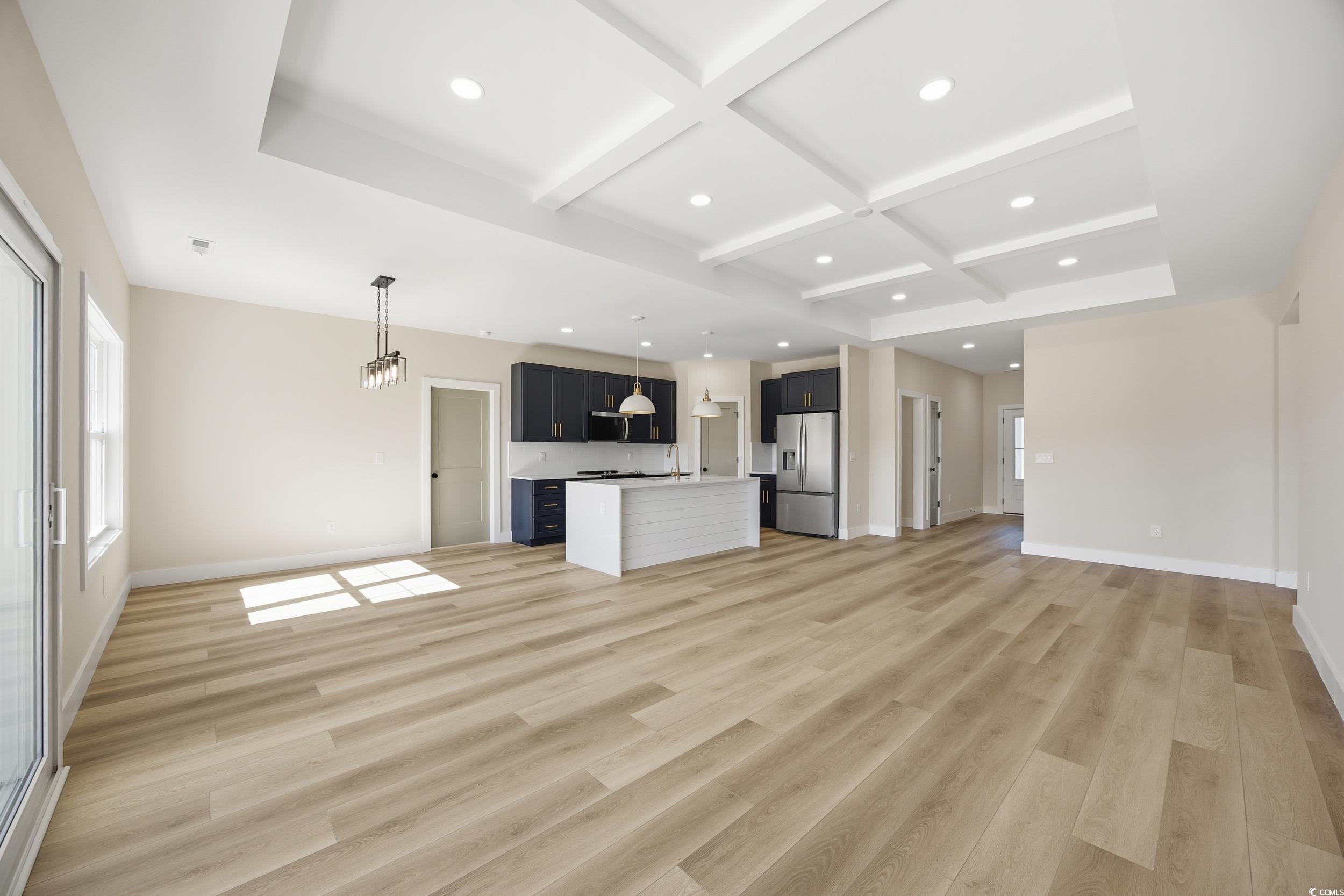 631 Highway 548 Conway Sc 29527 Conway, SC 29527 - Photo 8 of 40 Unfurnished living room with beamed ceiling, coffered ceiling, light wood finished floors, and recessed lighting