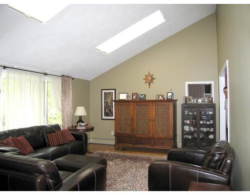74 Old Farm Road Reading, MA 01867 - Photo 2 of 8 a living room with furniture and a large window