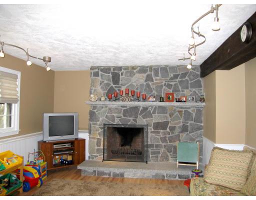 74 Old Farm Road Reading, MA 01867 - Photo 3 of 8 a living room with furniture and a fireplace