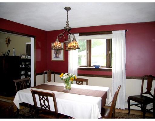 74 Old Farm Road Reading, MA 01867 - Photo 5 of 8 a view of a dining room with furniture and chandelier