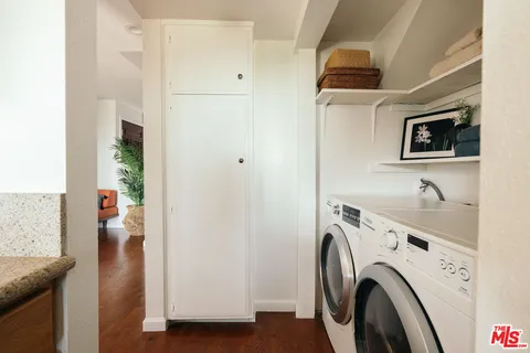 a view of storage and utility room with washer and dryer