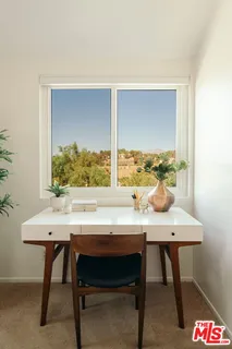 a view of a workspace with furniture