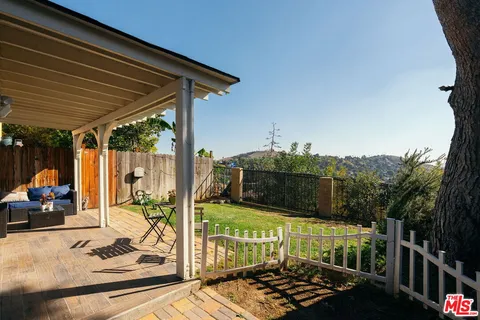 a view of a balcony with chairs