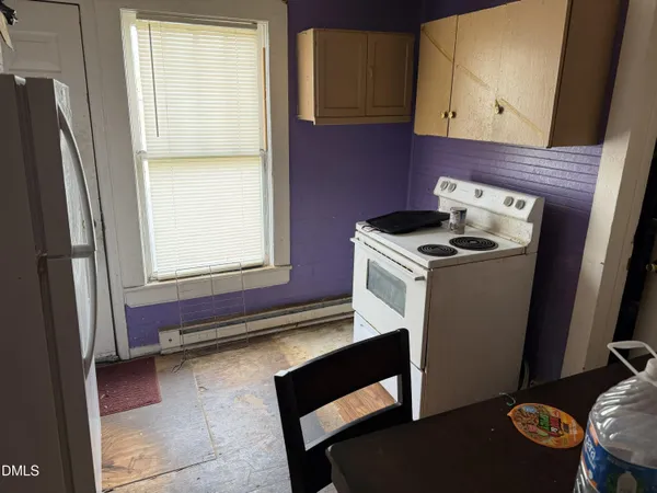 a kitchen with a stove and a microwave