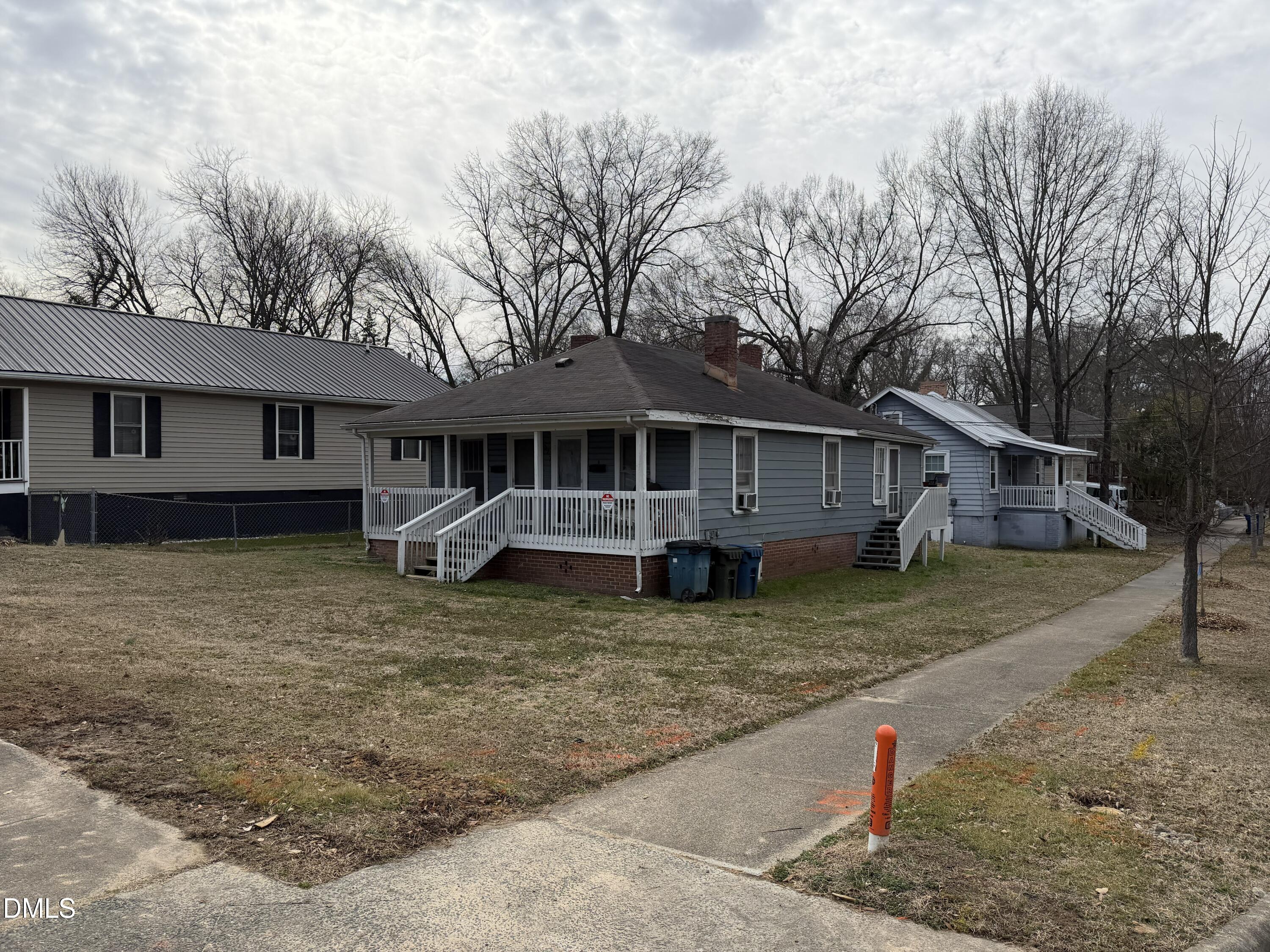 927 Berkeley Street Durham, NC 27705 - Photo 2 of 13 a view of a house with a yard
