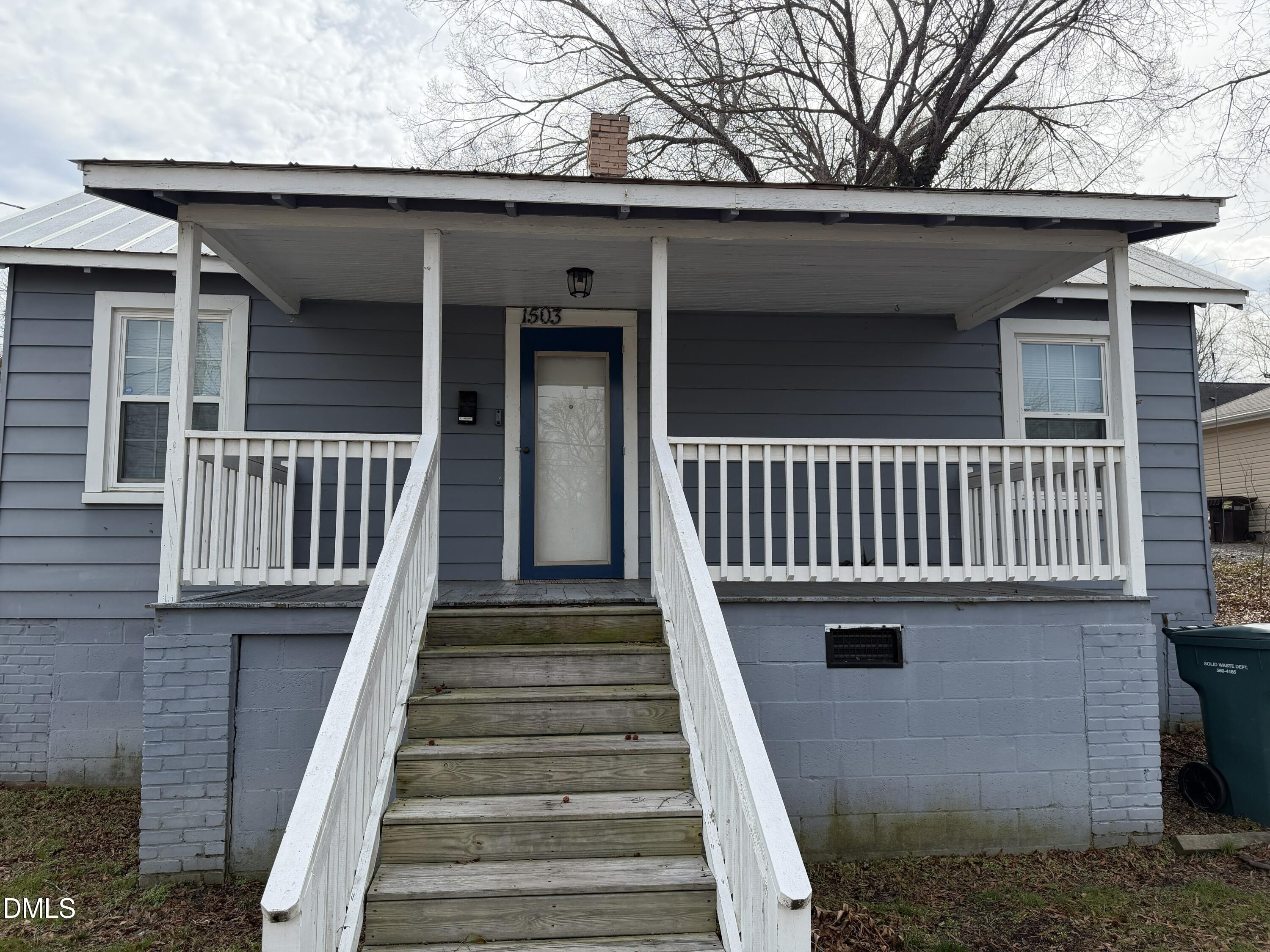 927 Berkeley Street Durham, NC 27705 - Photo 5 of 13 a view of a house with a deck