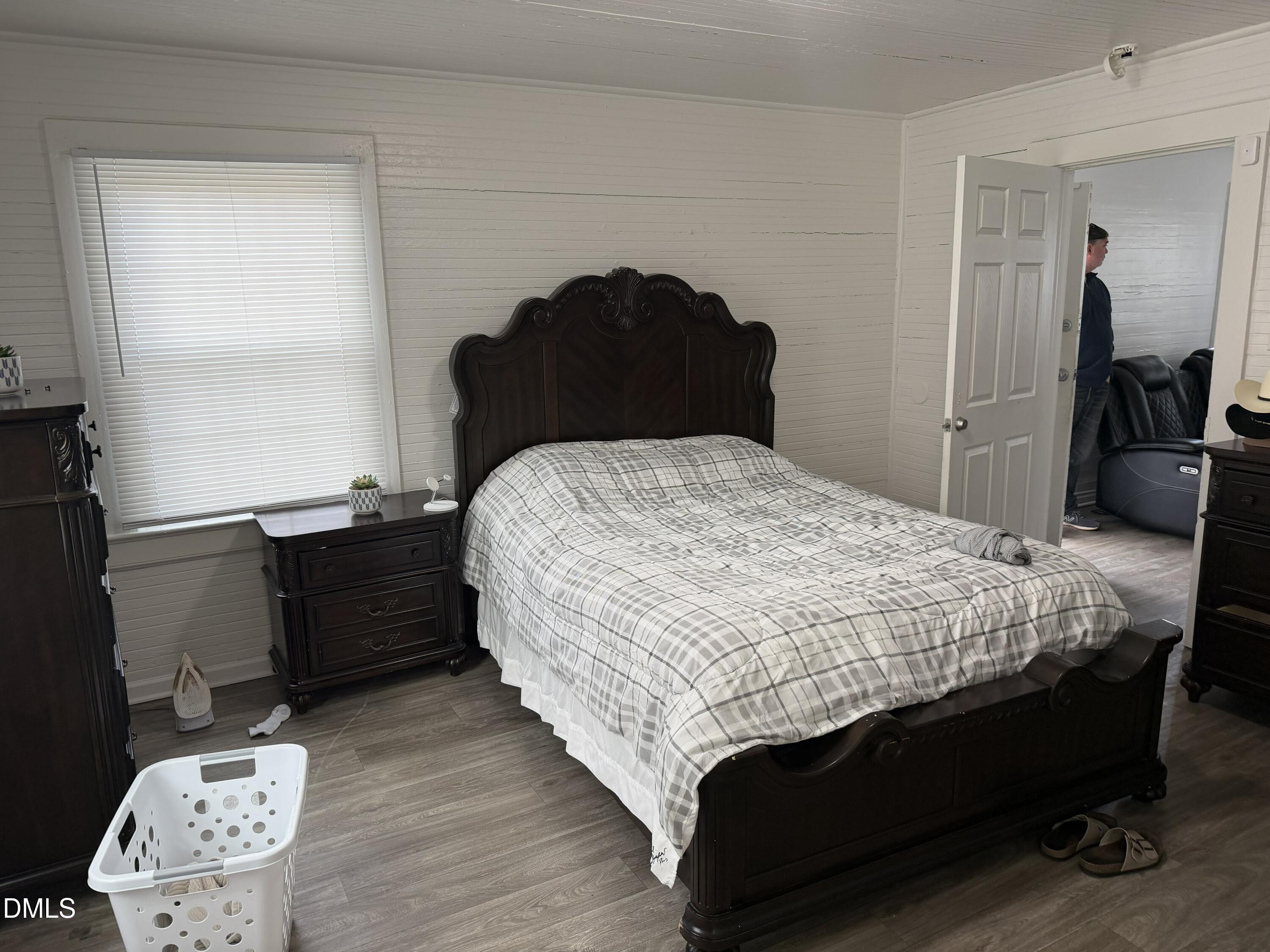 927 Berkeley Street Durham, NC 27705 - Photo 9 of 13 a bedroom with bed and window