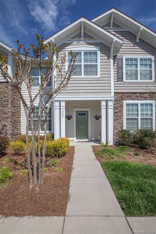 228 Falling Ridge, Unit 151 Belmont, NC 28012 - Photo 1 of 15 a front view of a house with garden