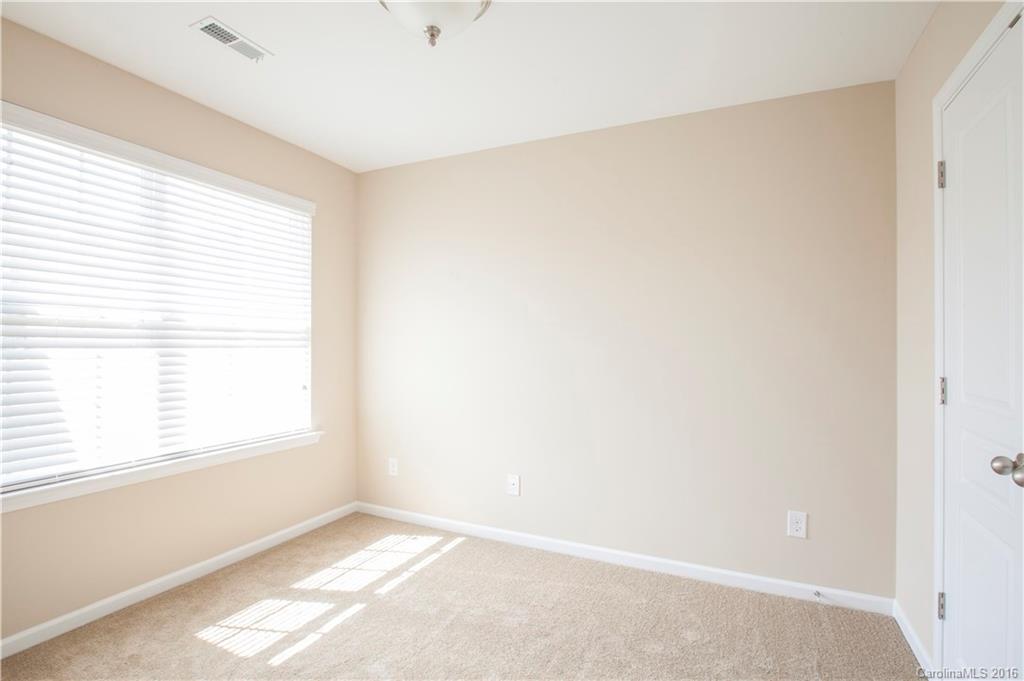 228 Falling Ridge, Unit 151 Belmont, NC 28012 - Photo 12 of 15 a view of an empty room with a window