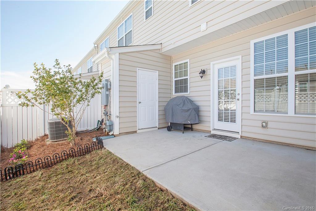 228 Falling Ridge, Unit 151 Belmont, NC 28012 - Photo 14 of 15 a view of a house with backyard and sitting area