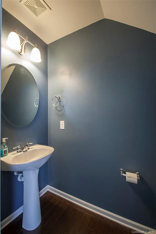 228 Falling Ridge, Unit 151 Belmont, NC 28012 - Photo 7 of 15 a bathroom with a toilet sink and mirror