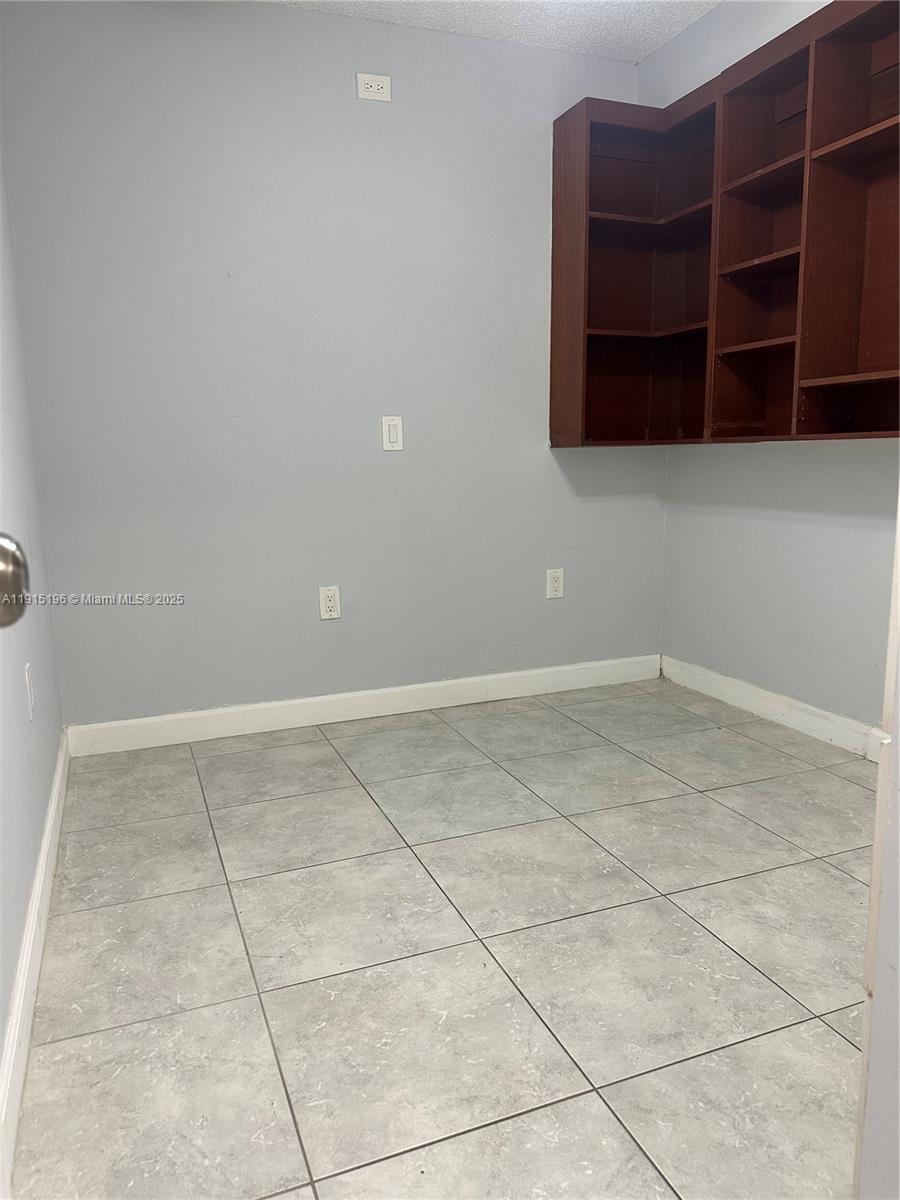 1526 Whitehall Drive, Unit 403 Davie, FL 33324 - Photo 13 of 16 a view of an empty room