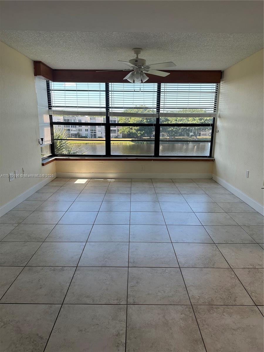 1526 Whitehall Drive, Unit 403 Davie, FL 33324 - Photo 5 of 16 a view of an empty room with a window