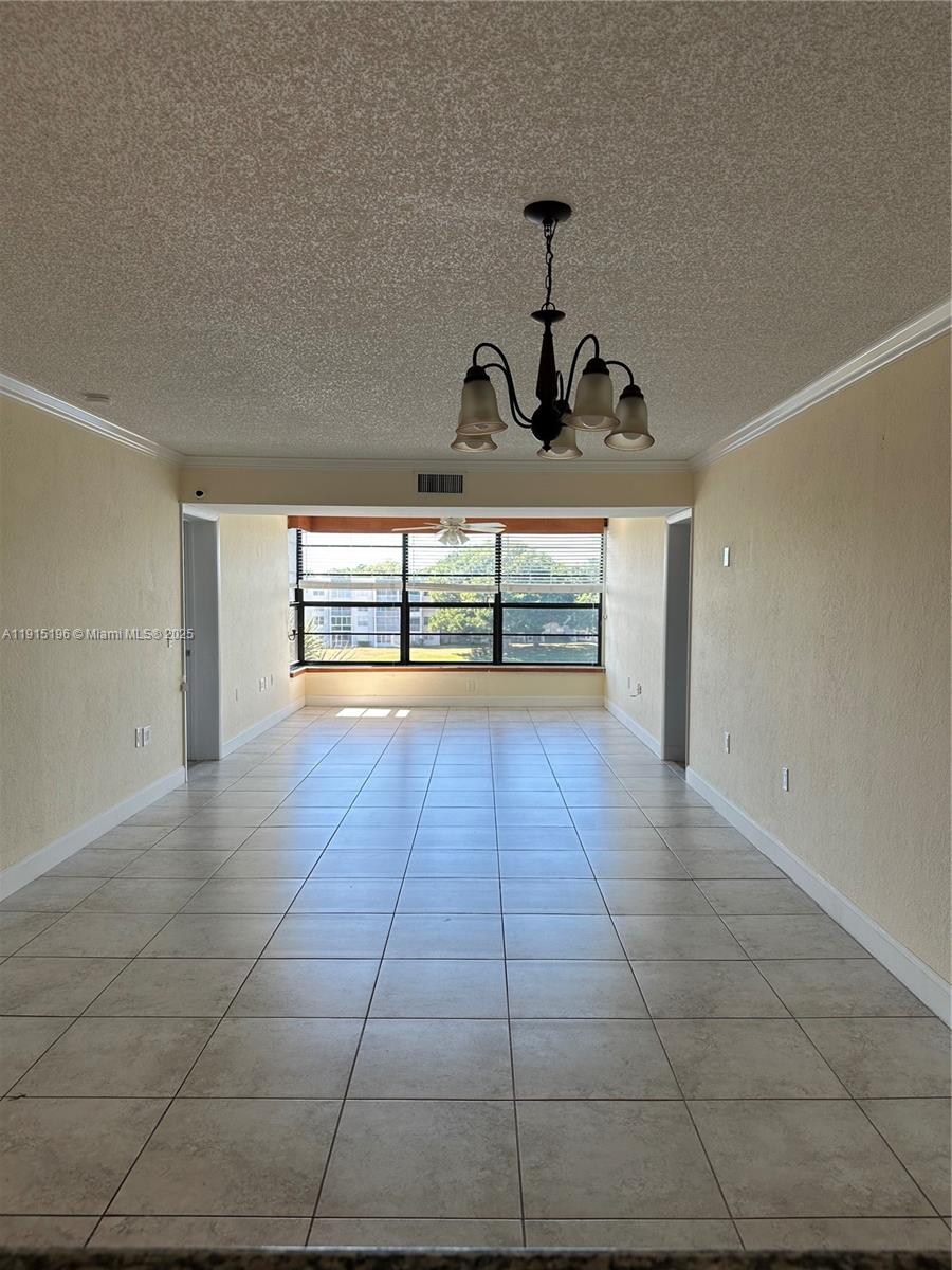 1526 Whitehall Drive, Unit 403 Davie, FL 33324 - Photo 8 of 16 a view of an empty room and window