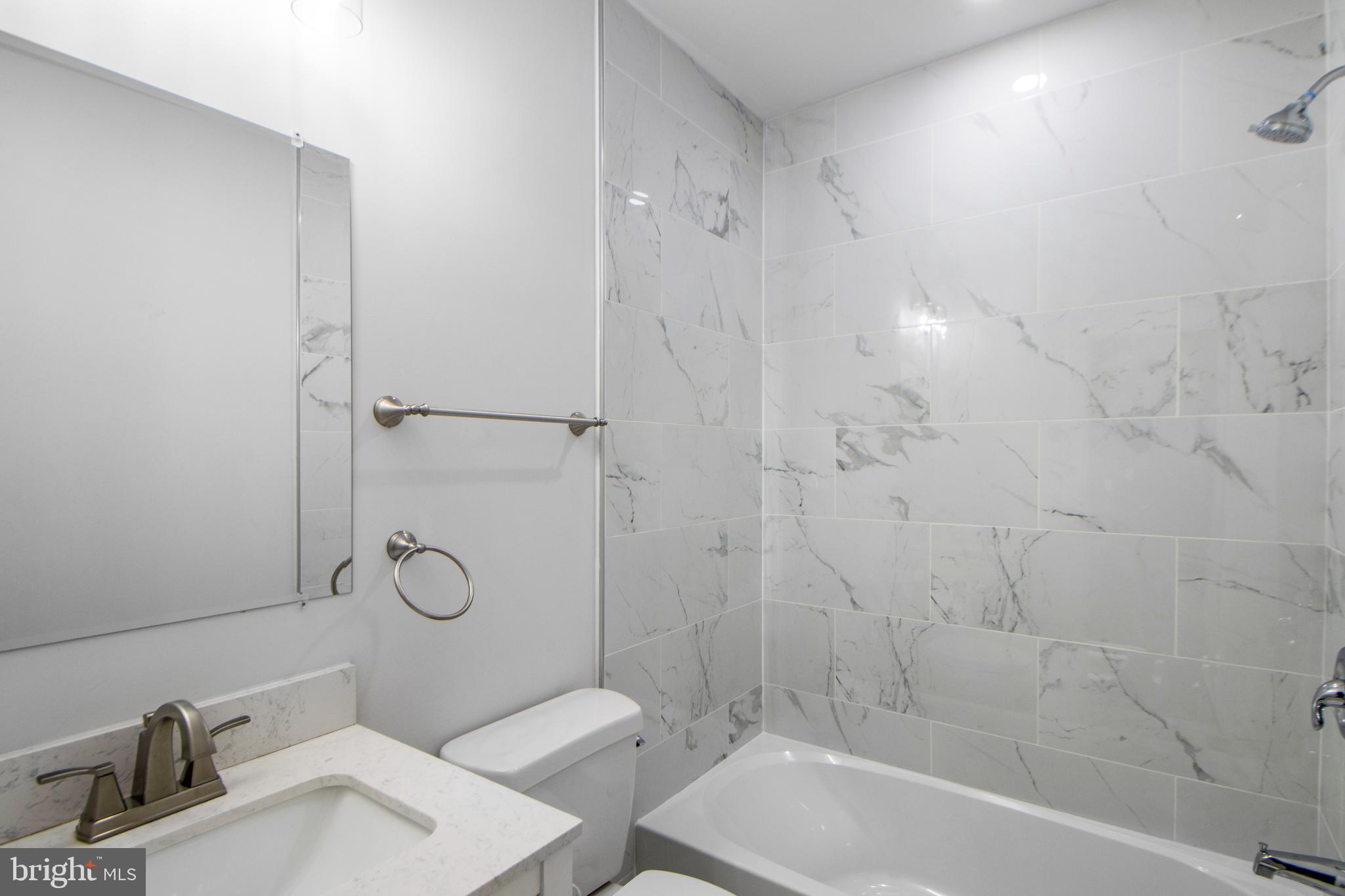 3706 Overview Road Baltimore, MD 21215 - Photo 16 of 47 a bathroom with a sink toilet and shower