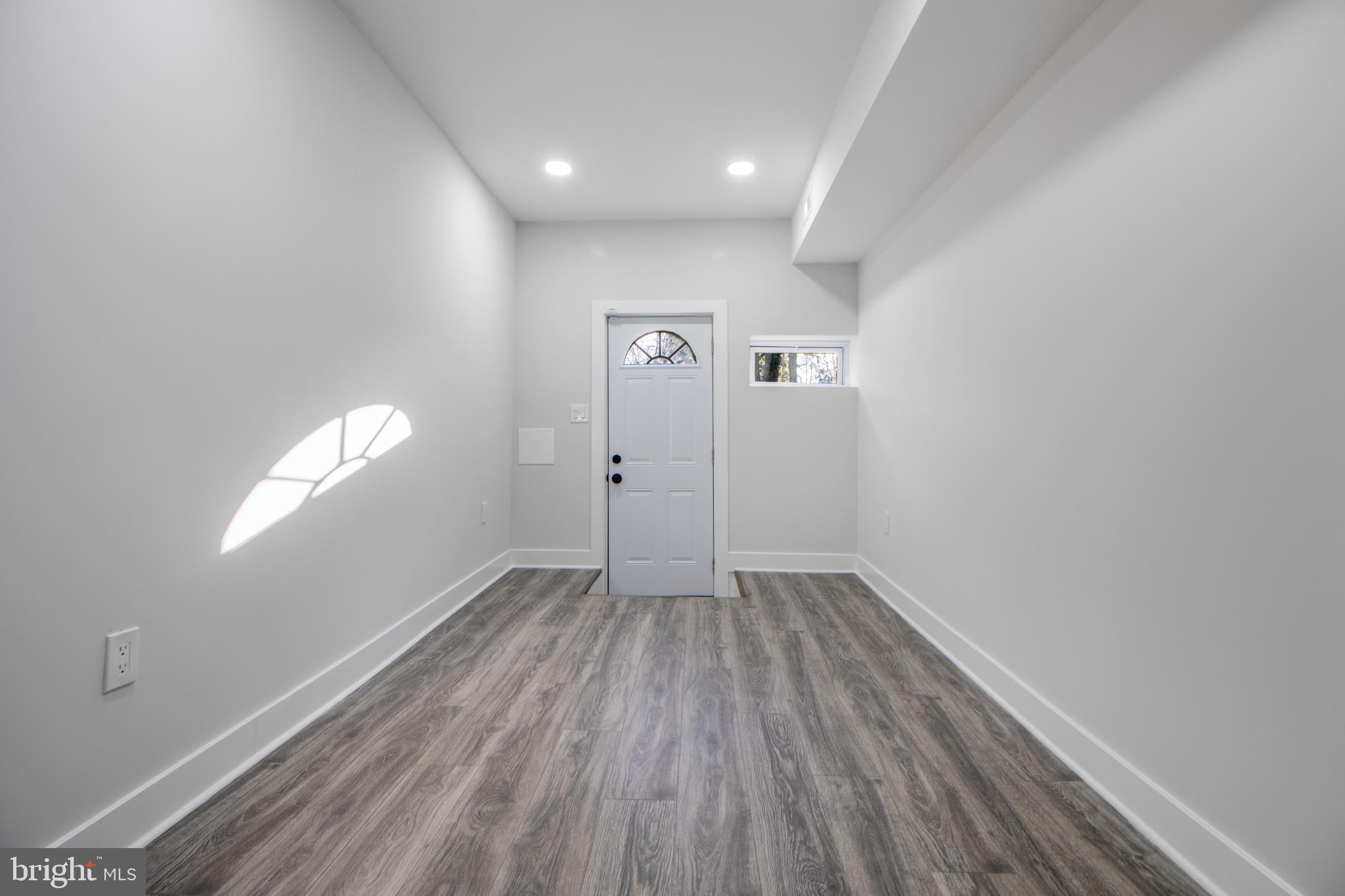 3706 Overview Road Baltimore, MD 21215 - Photo 22 of 47 a view of empty room with wooden floor and fan